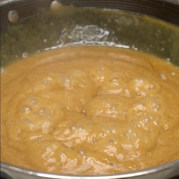 Coconut and panutsa mixture simmering in the pan.
