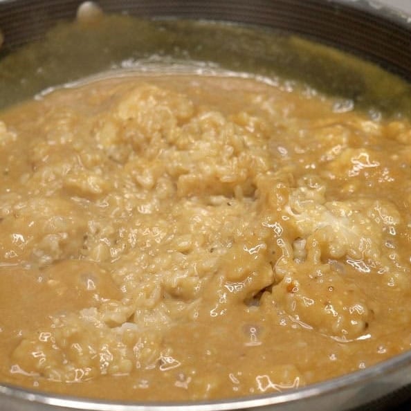 Glutinous rice cooking in the coconut and panutsa mixture.