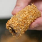 Holding a piece of Tikoy Roll.