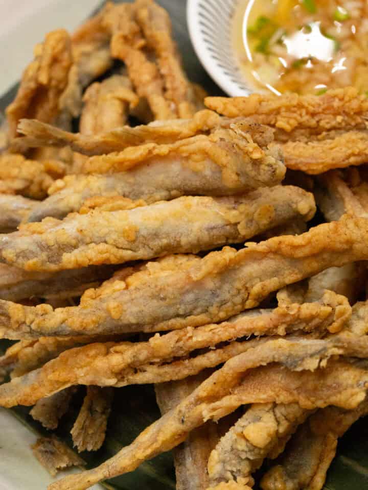 Crispy fried Smelt on a plate with sauce