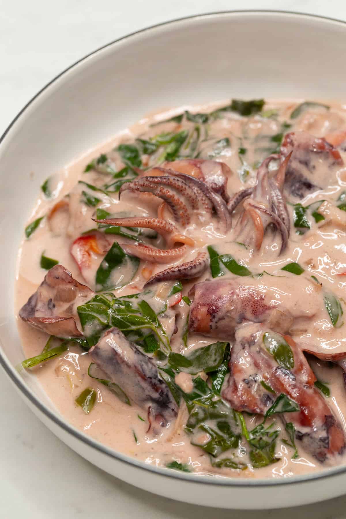 Ginataang Pusit with Malunggay in a bowl.