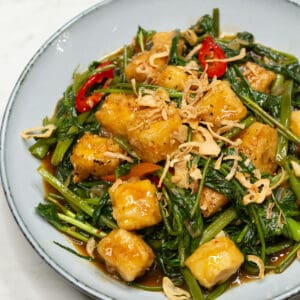 Stir Fried Kangkong and Tofu on a plate