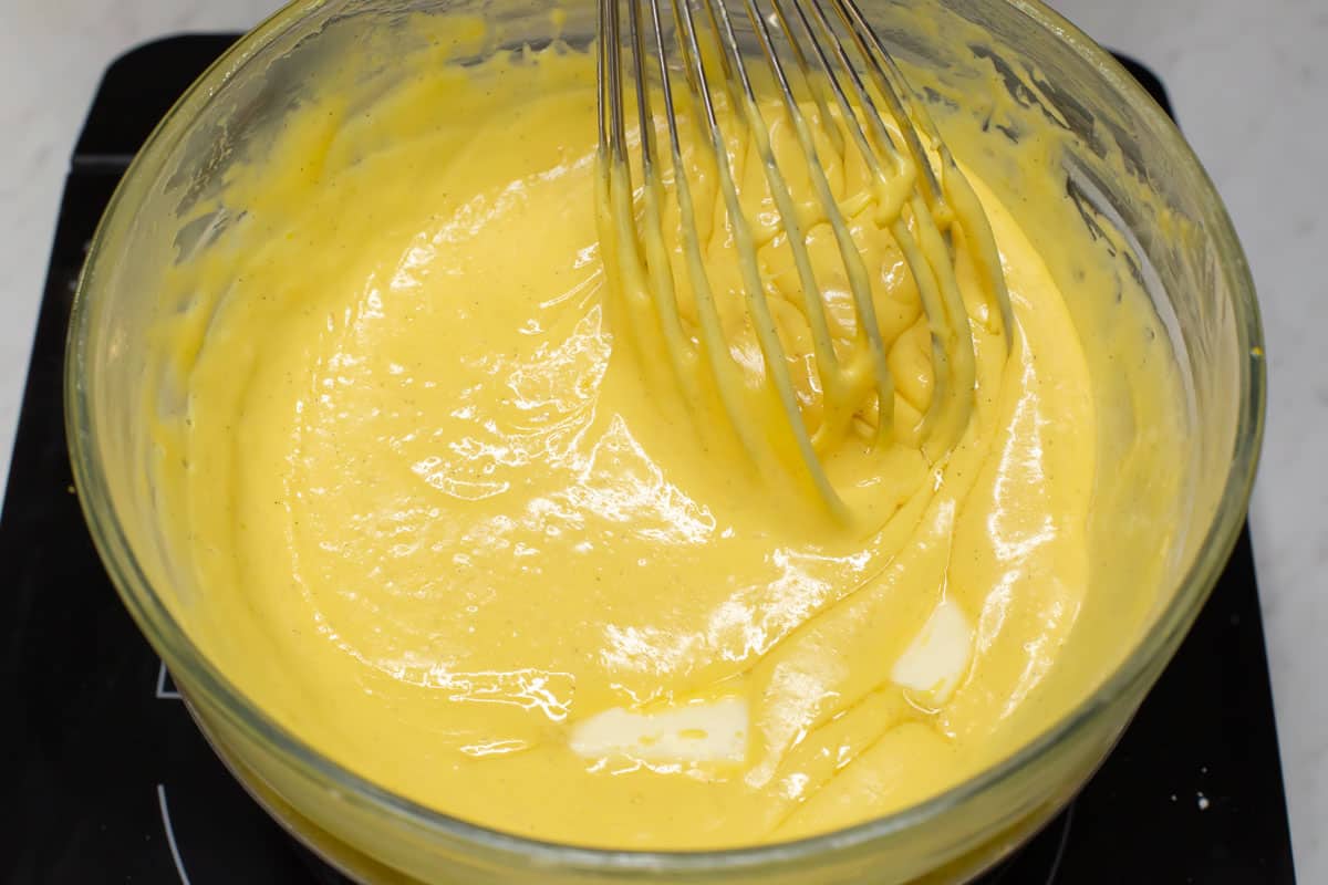 Blending the butter into the custard mixture.
