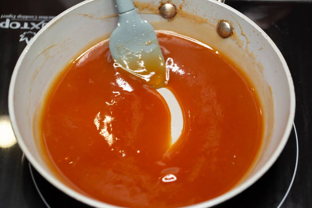 Sweet and sour dipping sauce in a skillet.