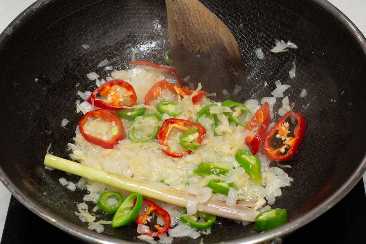 Sauteing the aromatics in a wok.