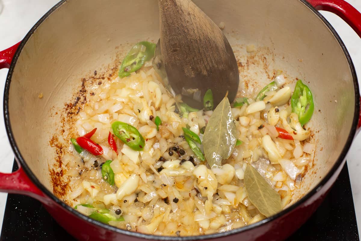 Sauteing the aromatics in the pot.