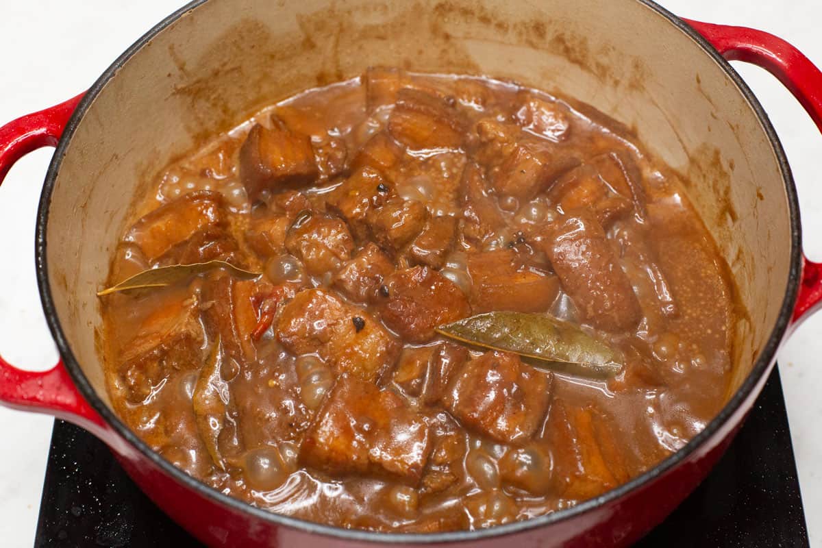 Simmering Adobo sa Gata (Adobo in Coconut Milk) in the pot.