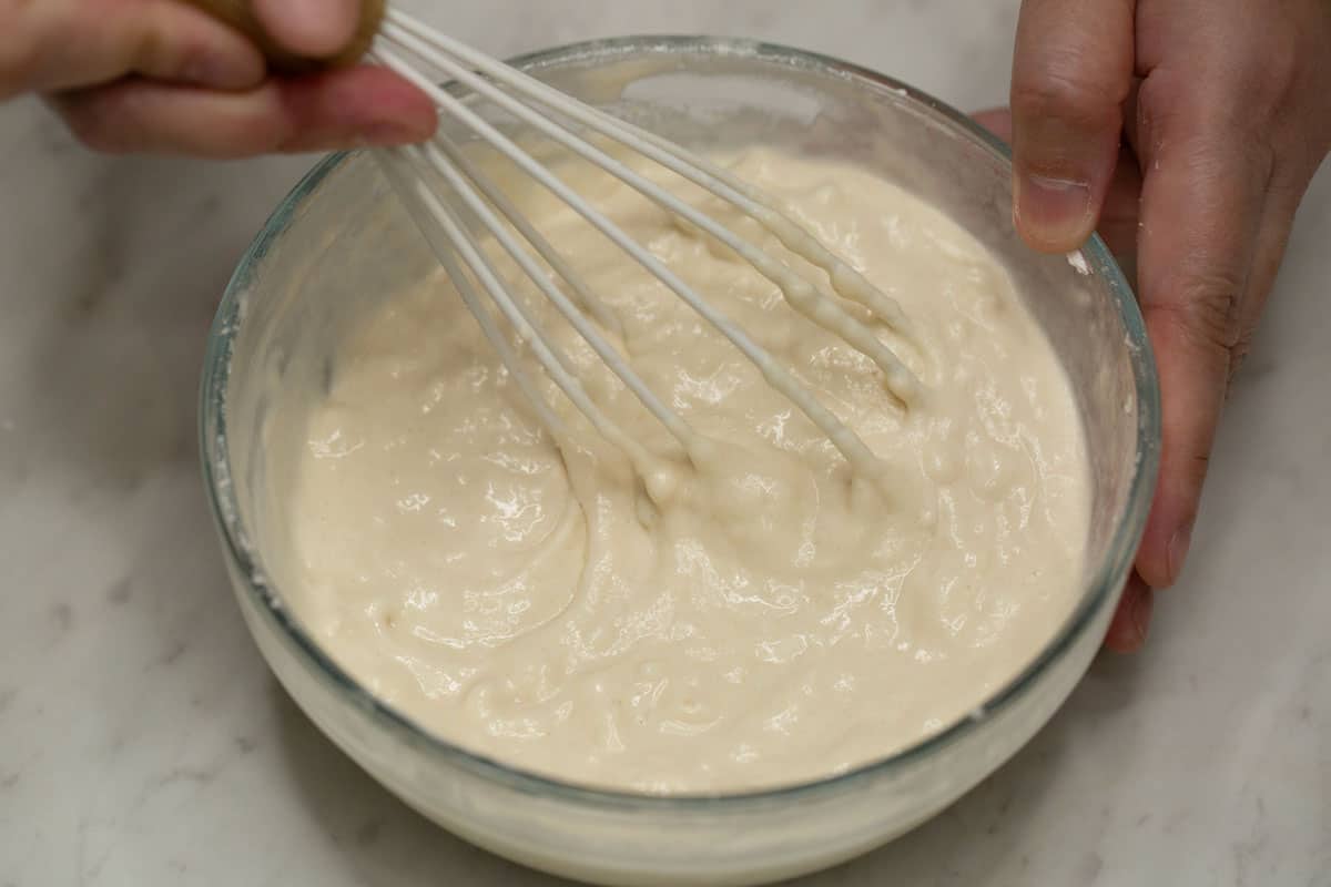 Whisking the batter in a bowl.