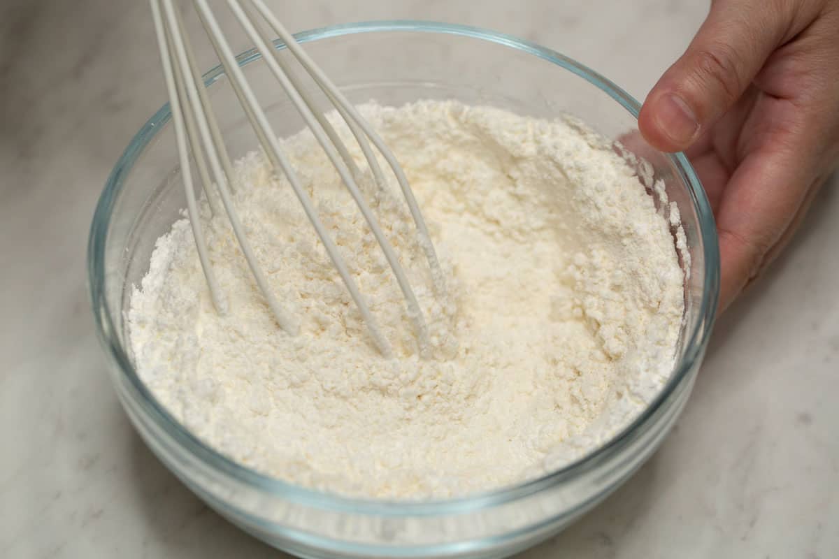 Mixing the dry ingredients for the batter.