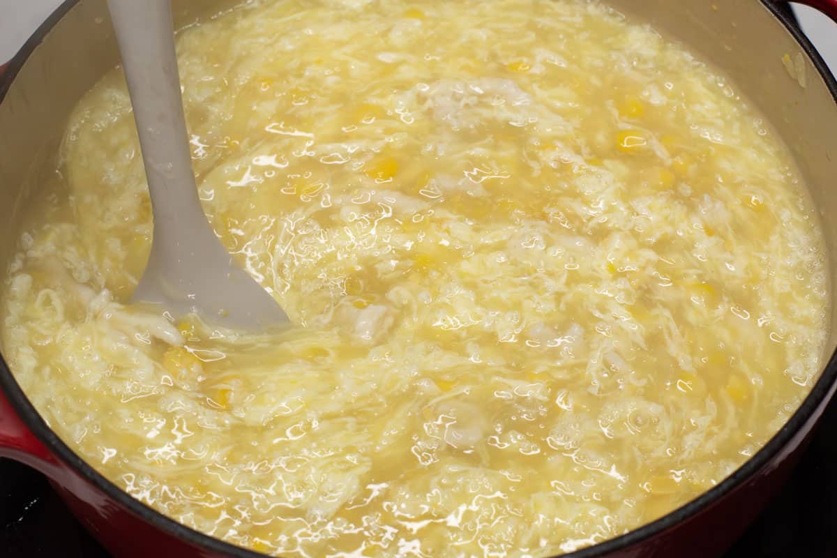Mixing the egg ribbons in the pot.
