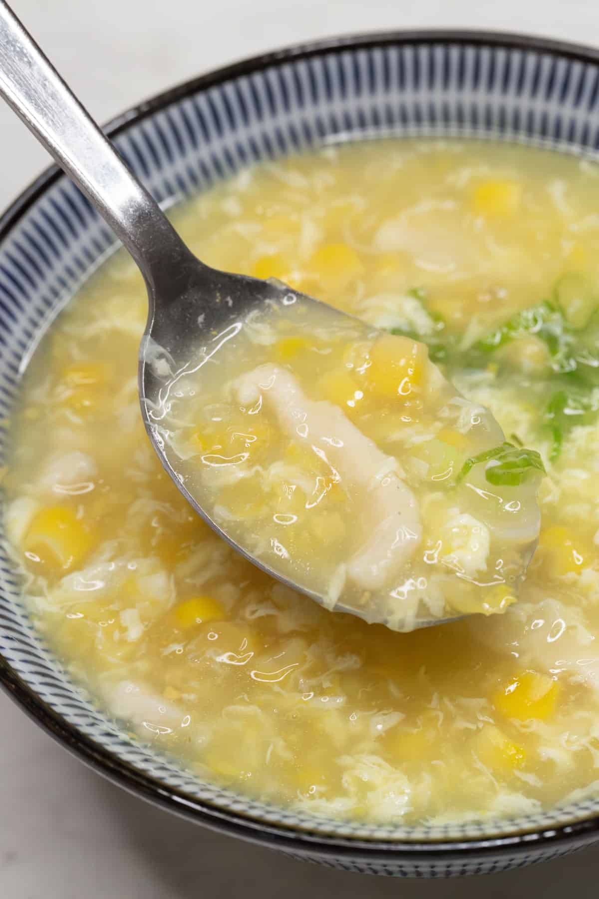 Chicken and Corn Soup in a spoon.