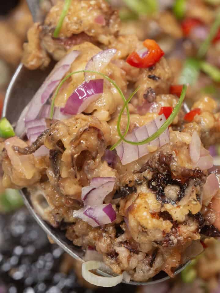 Crispy Squid Sisig on a spoon