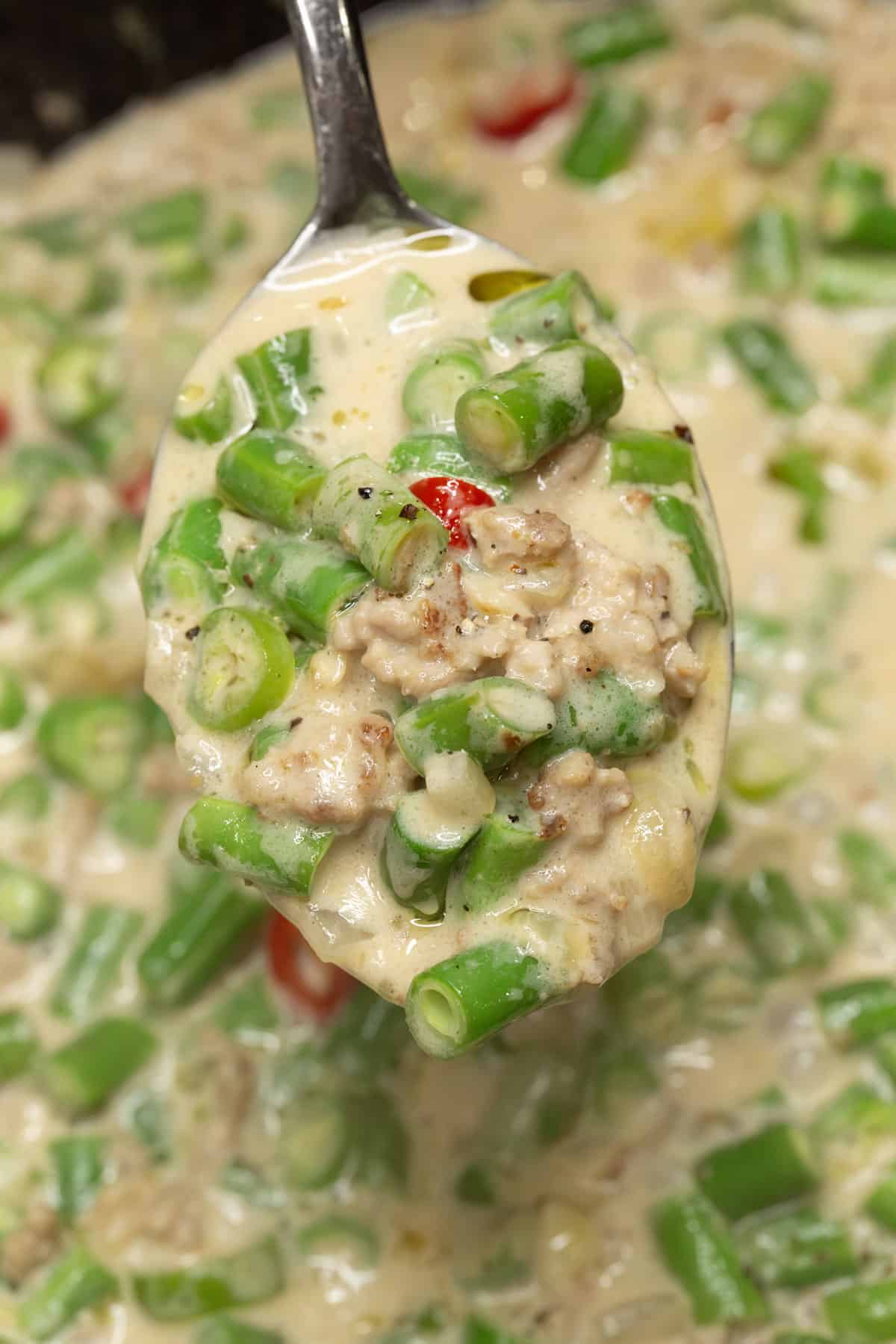 Gising Gising with Green Beans on a spoon.