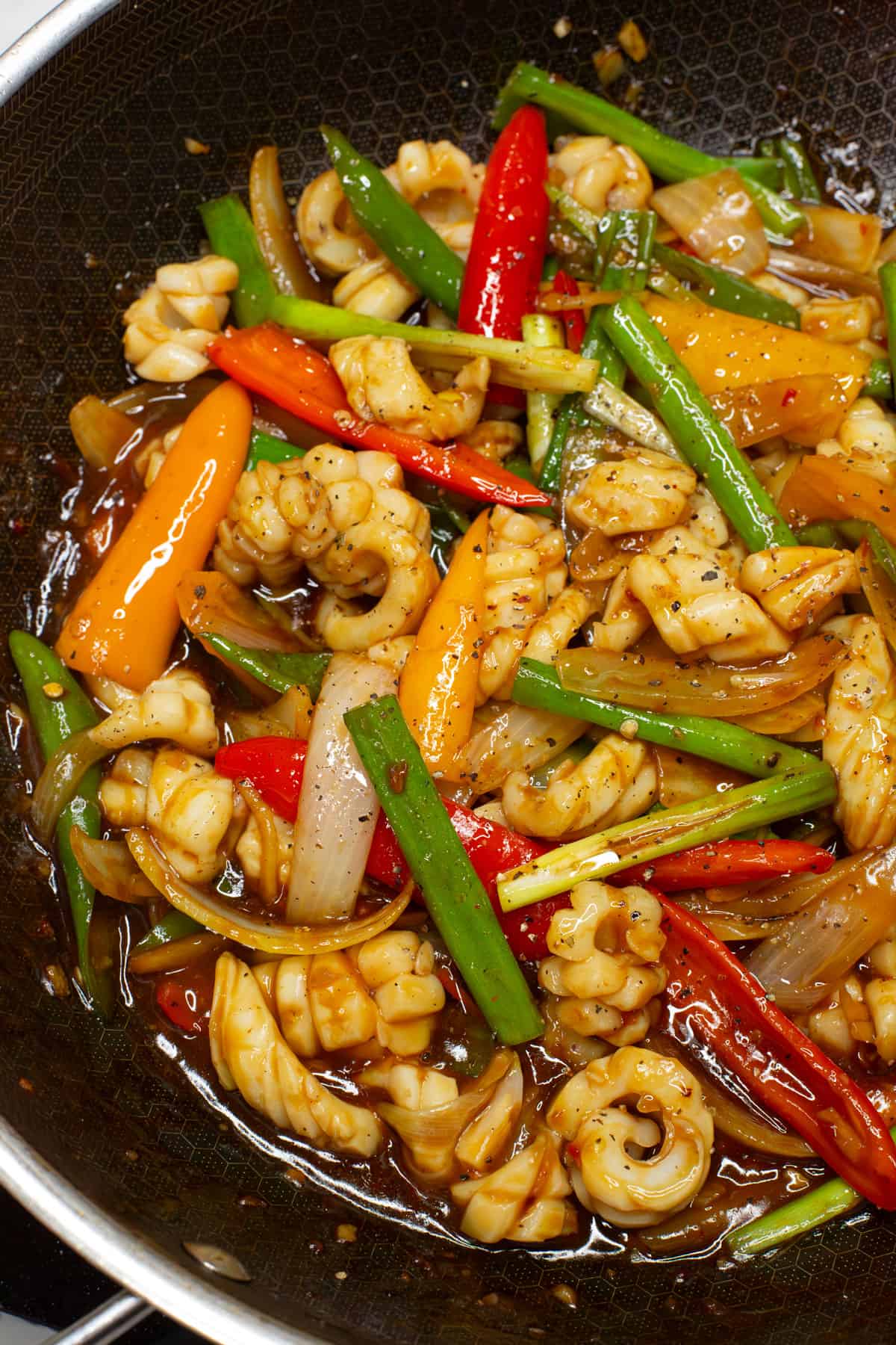 Squid Stirfry in a wok.