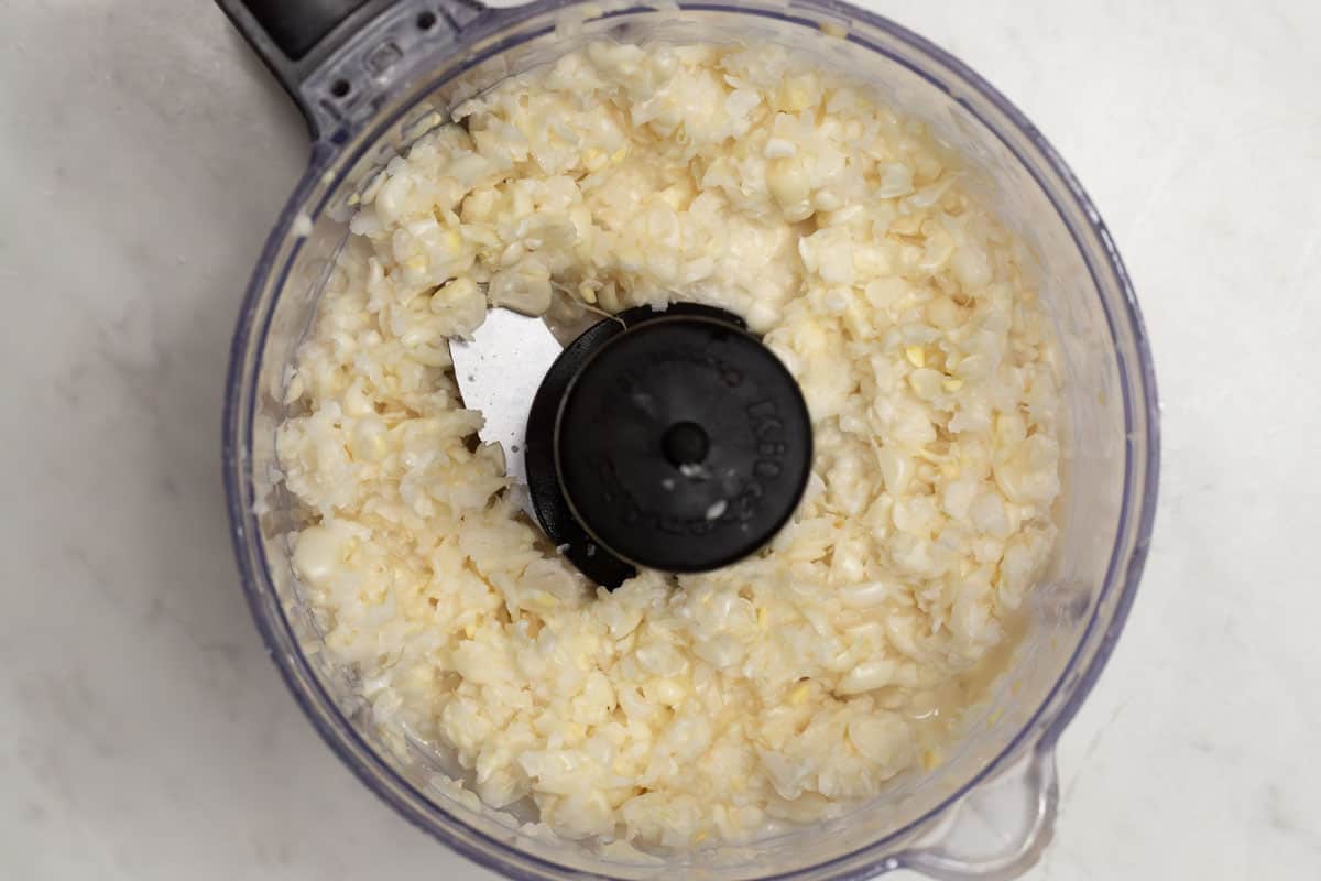 Coarsely chopped corn in a food processor.