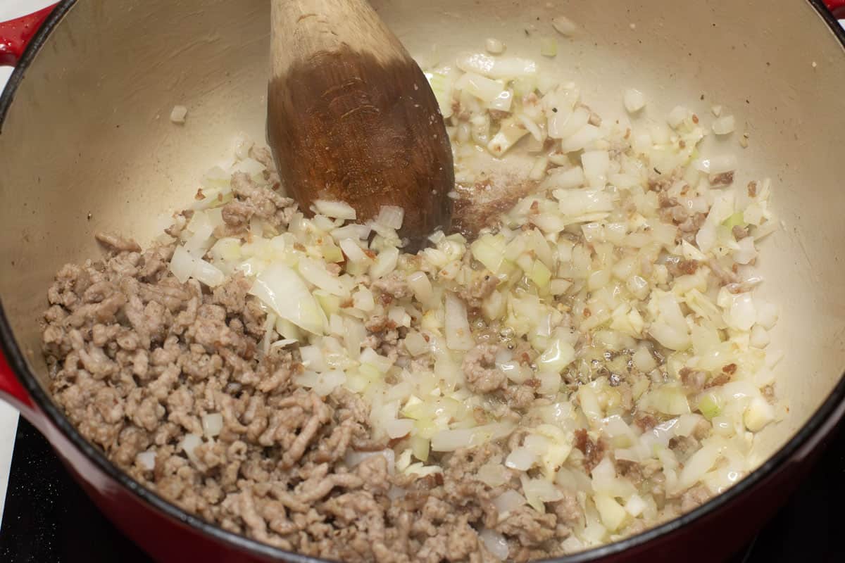 Sauteing the aromatics in the pot.
