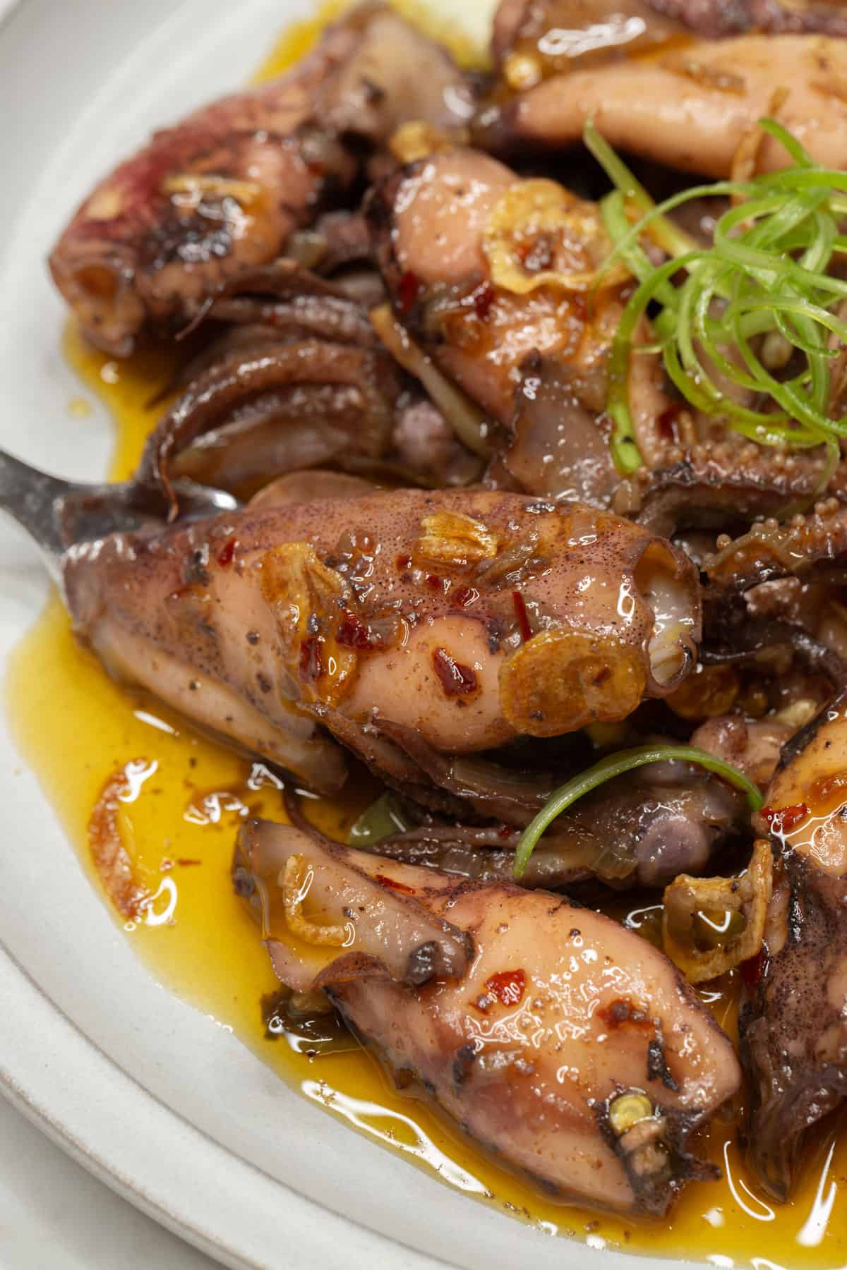 Squid in Garlic and Olive Oil on a plate.