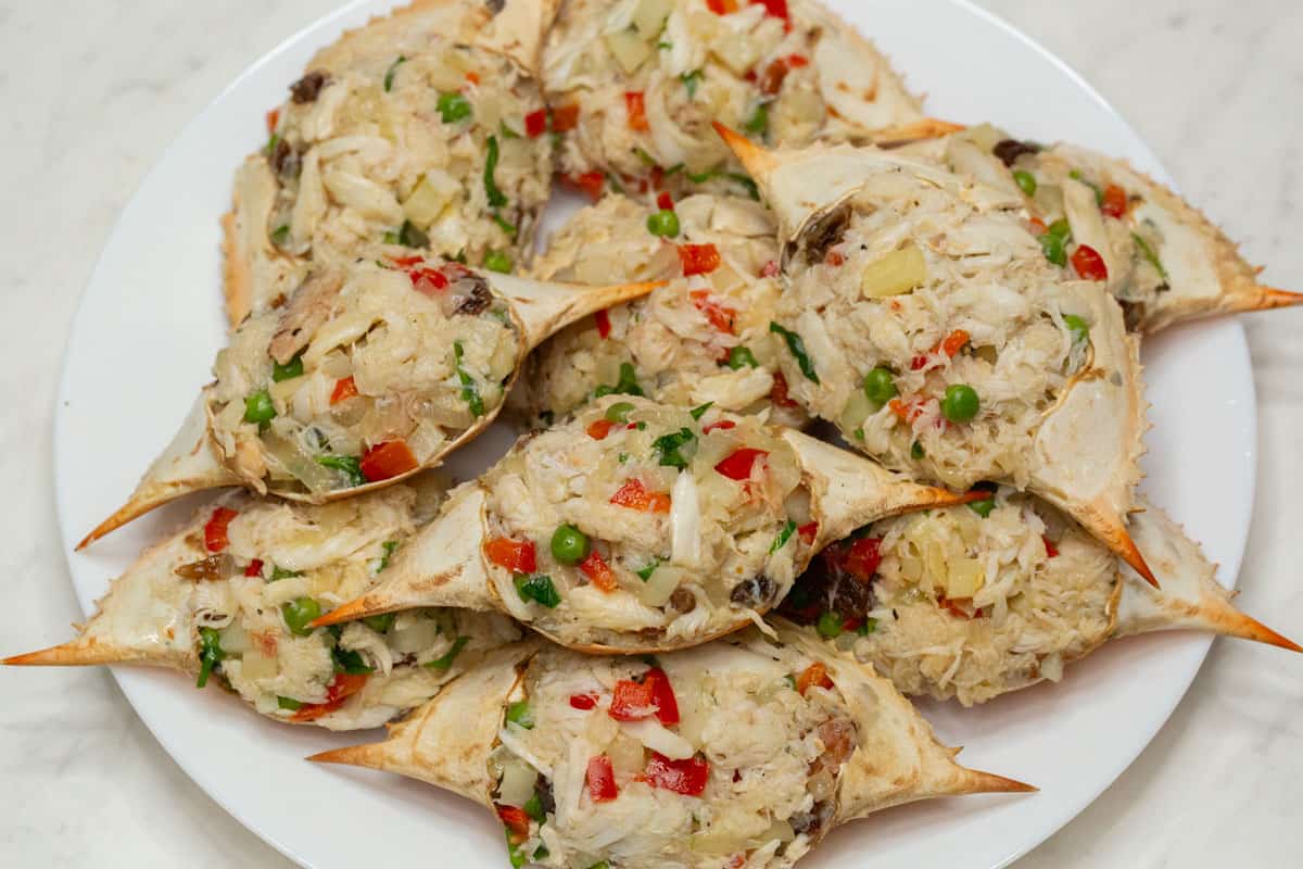 Stuffed crab shells on a plate.