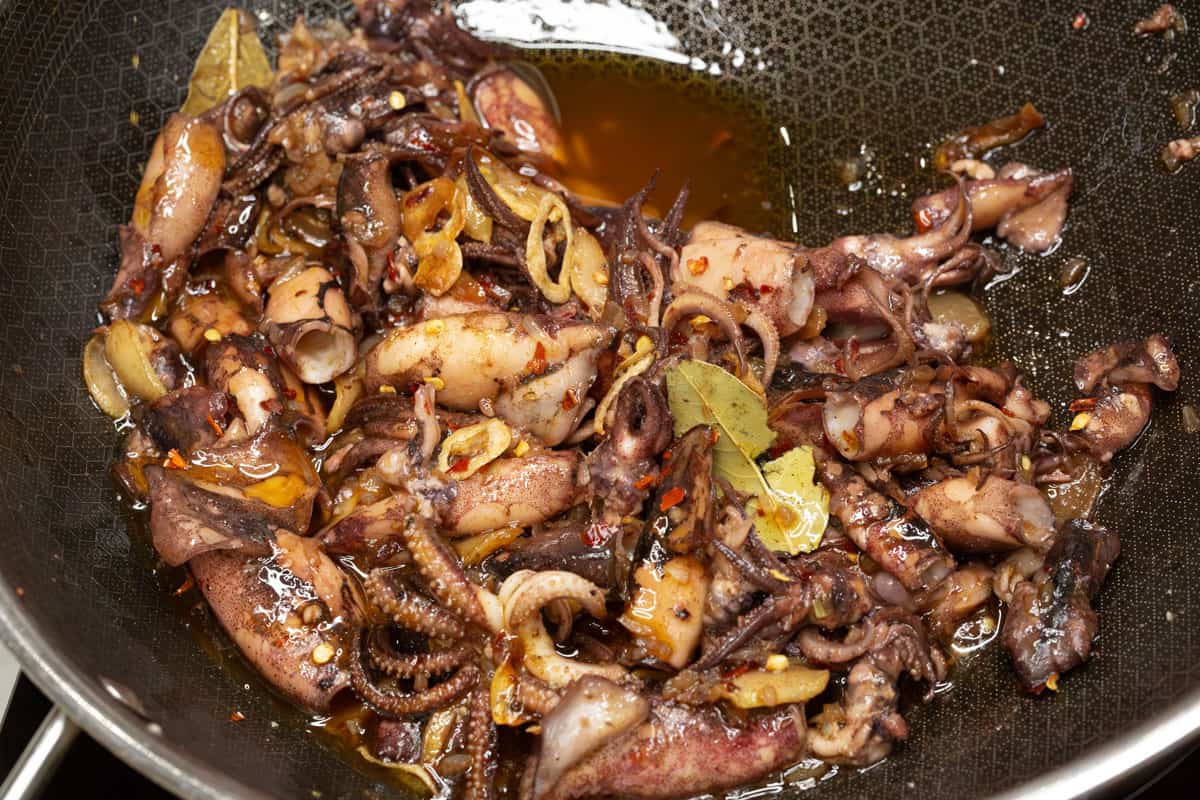 Squid in Garlic and Olive Oil in a wok.