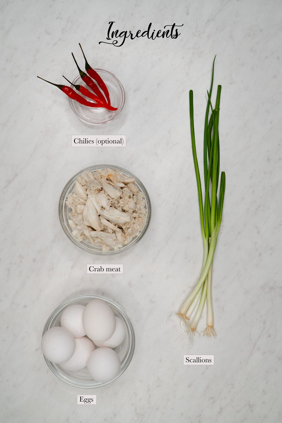 Individual ingredients for Tortang alimasag (crab omelet)