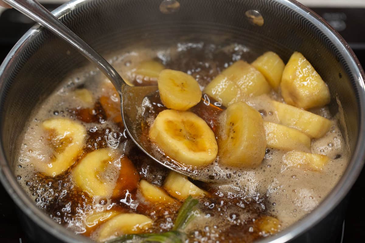 Minatamis na Saging (Sweetened Saba Bananas) in a saucepan.