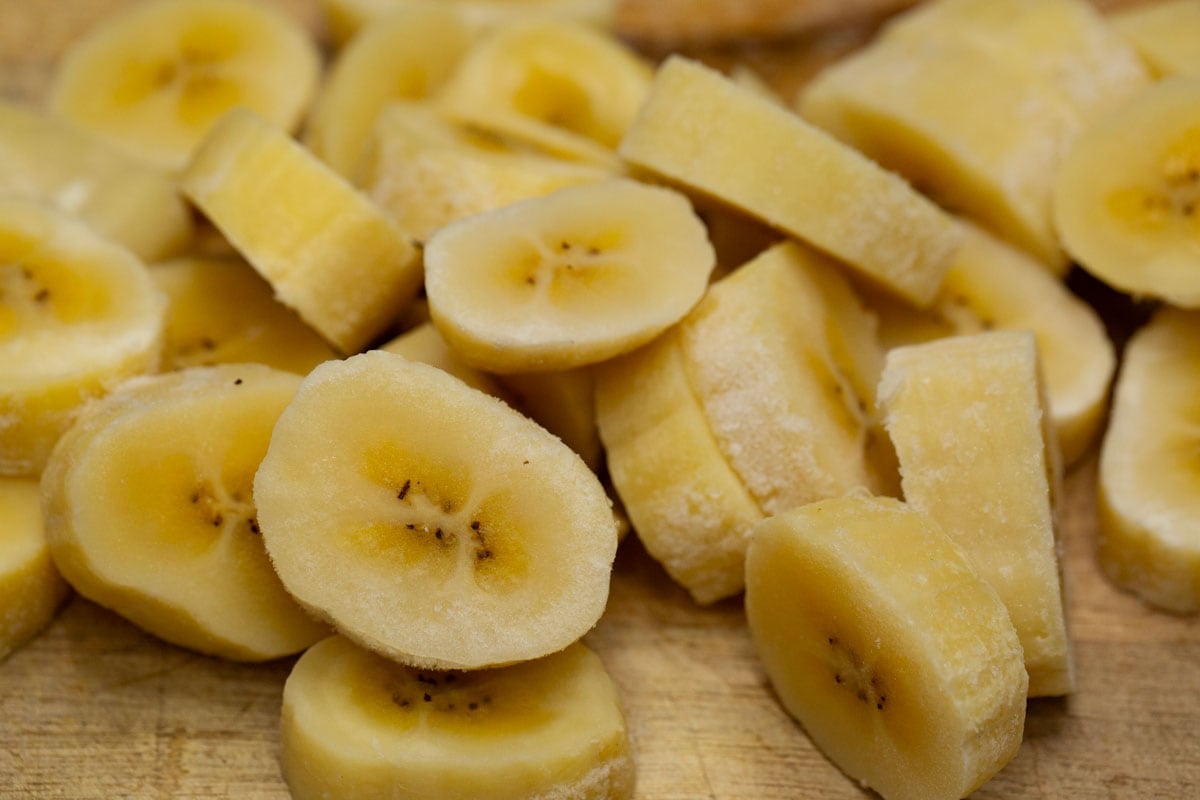 Banana pieces on a cutting board.