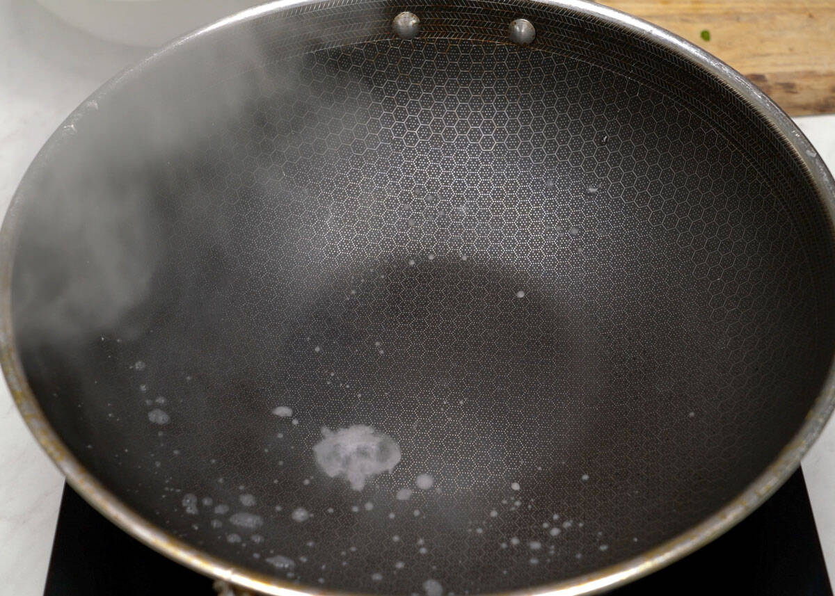 Water droplets in a very hot wok.