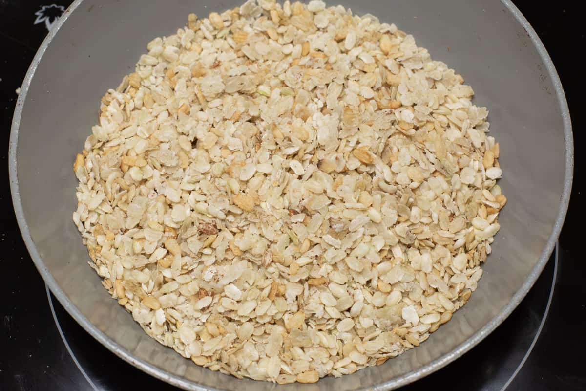 Toasting pinipig in a skillet.