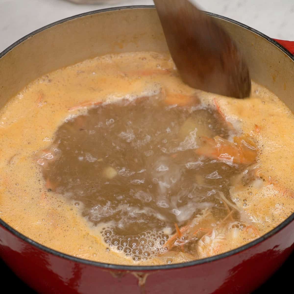 Shrimp broth boiling in the pot.