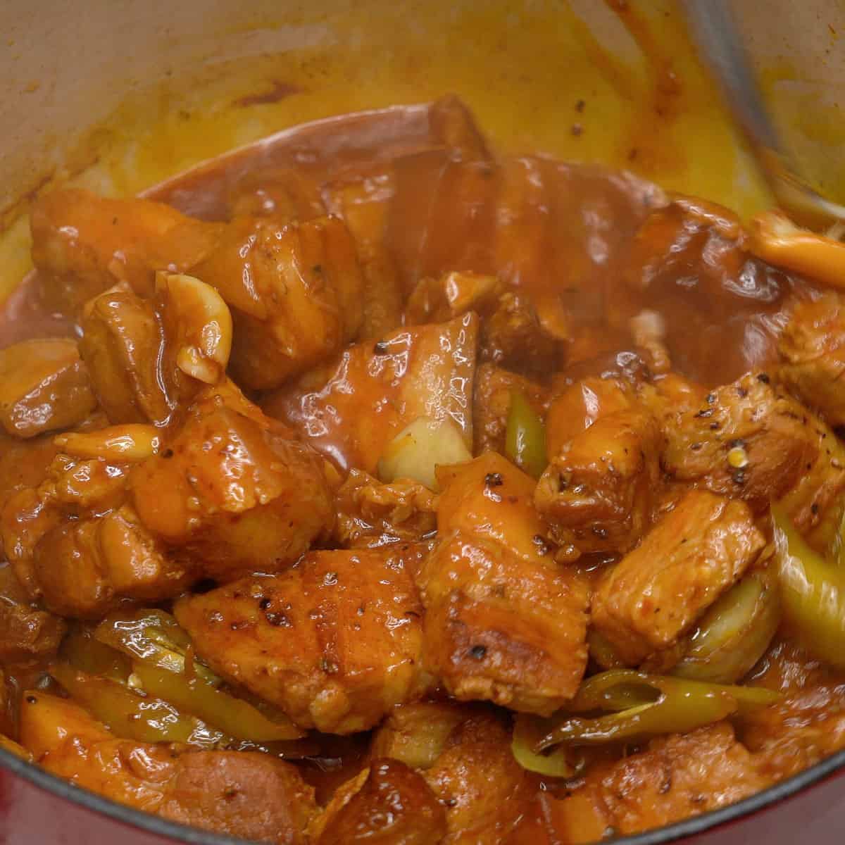 Cooked adobong pula in a pot.