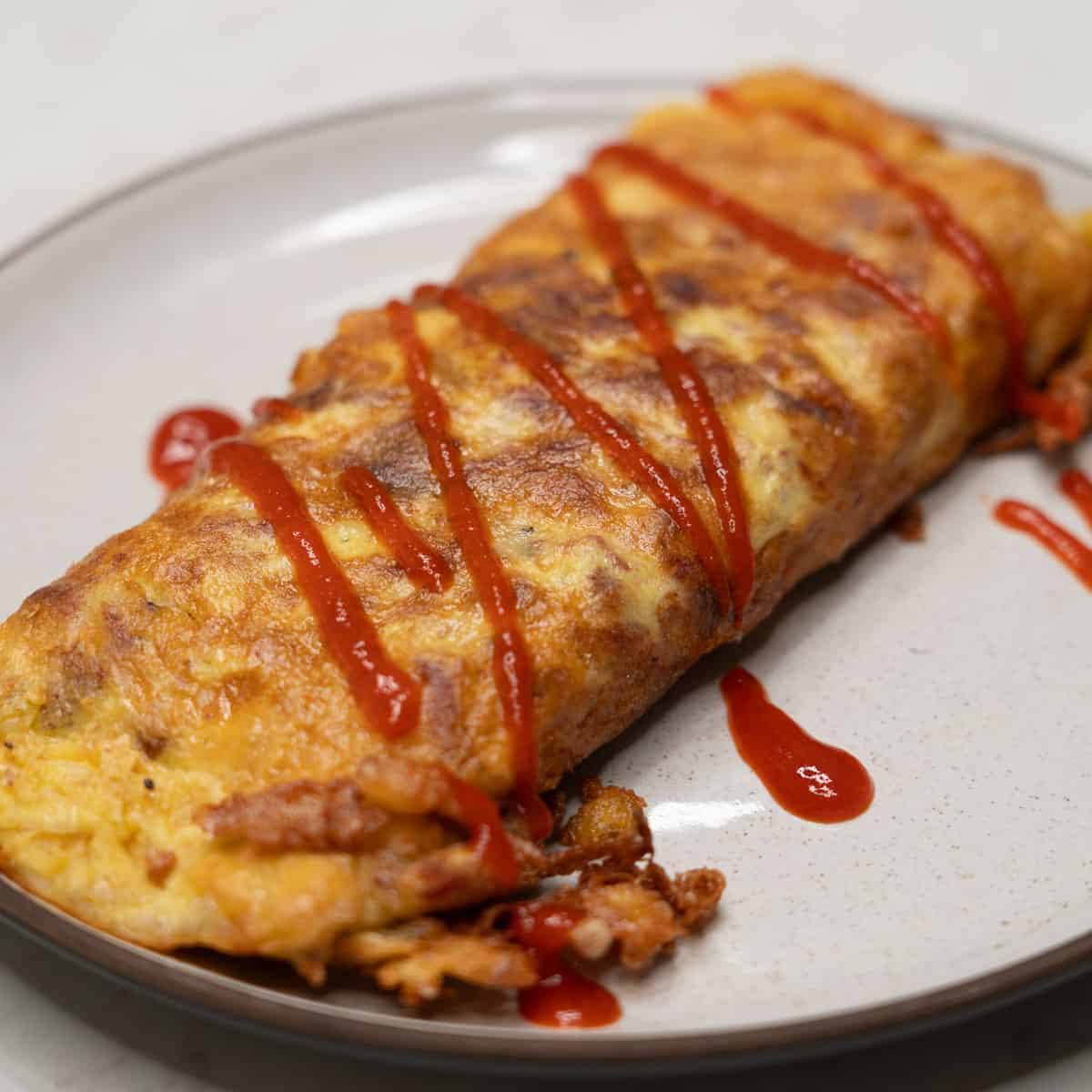 Tortang corned beef served on a plate.