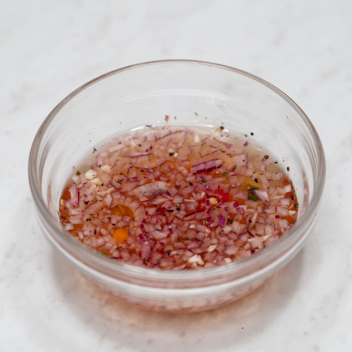 Vinegar dipping sauce in a bowl.