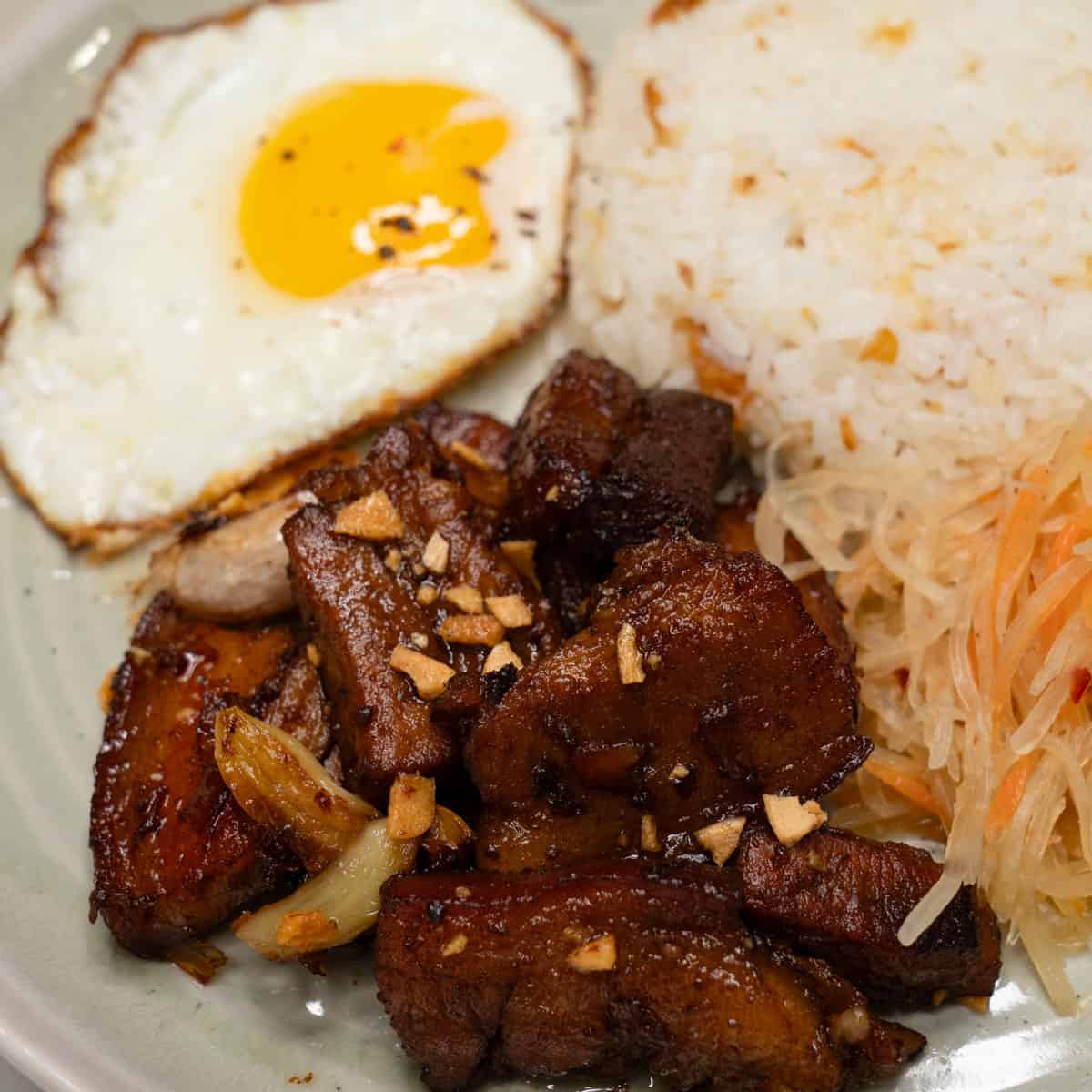 Adobong silog on a plate.