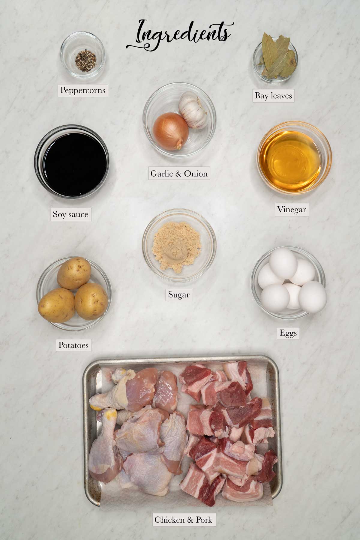 Individual ingredients for chicken and pork adobo (with potatoes and eggs) 