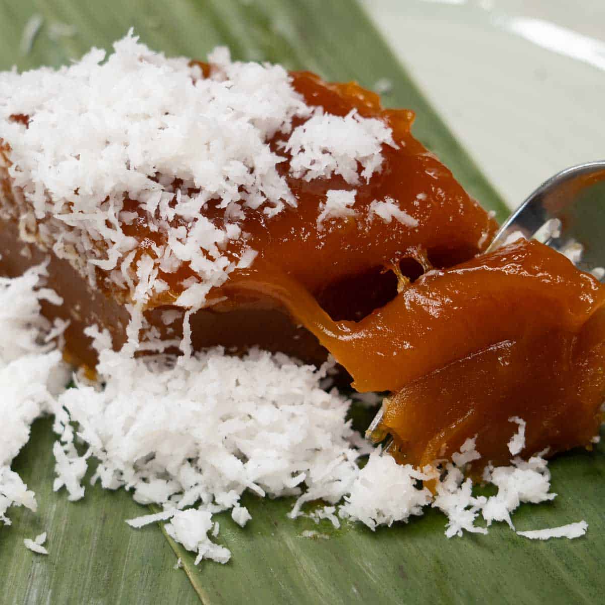 Cutting the kutsinta with a fork.