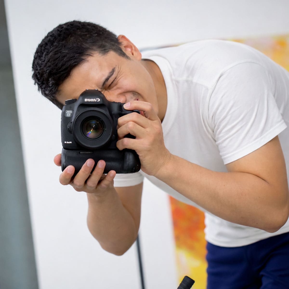 Mark holding a Canon 5D Mark III Camera