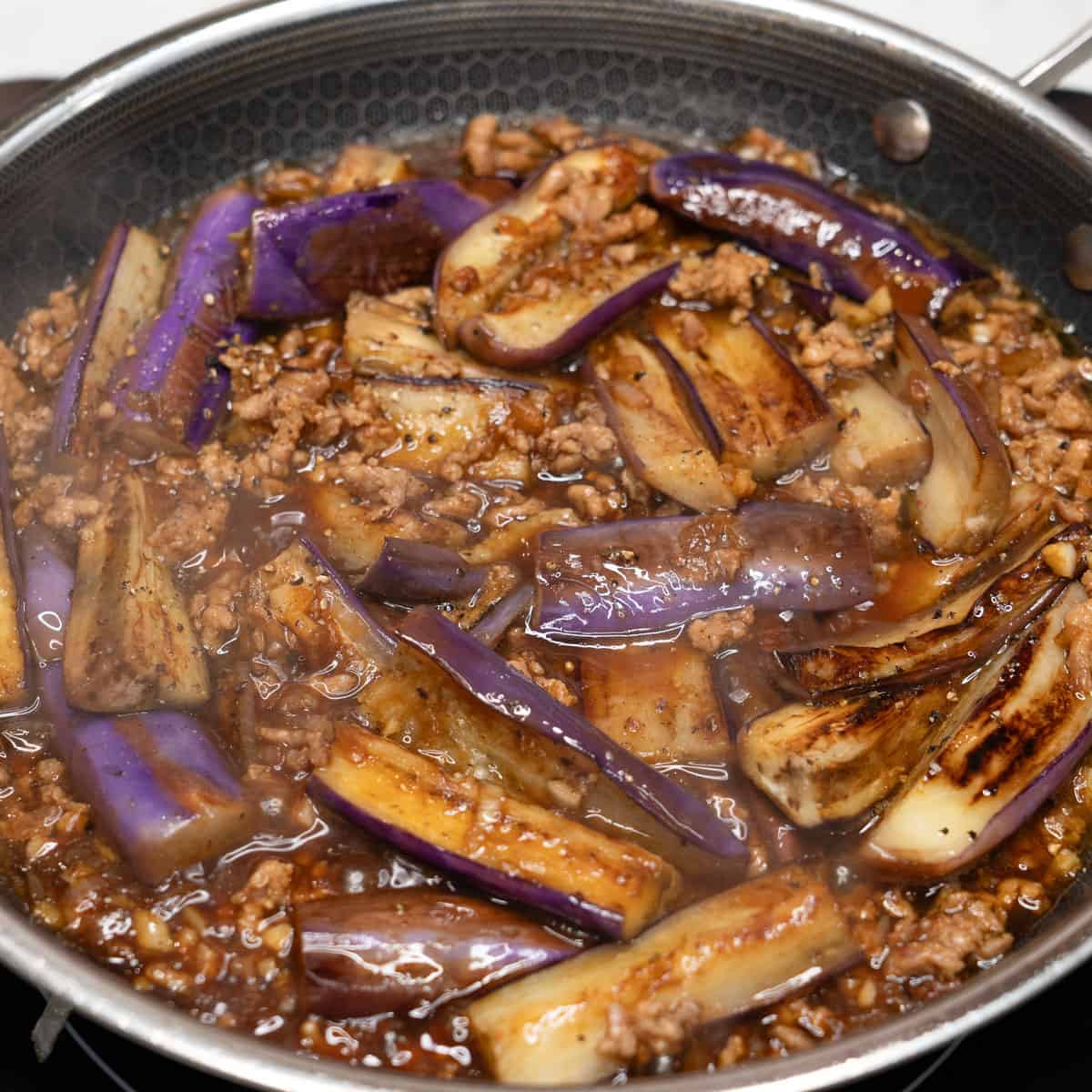 Adobong talong with giniling in the pan.
