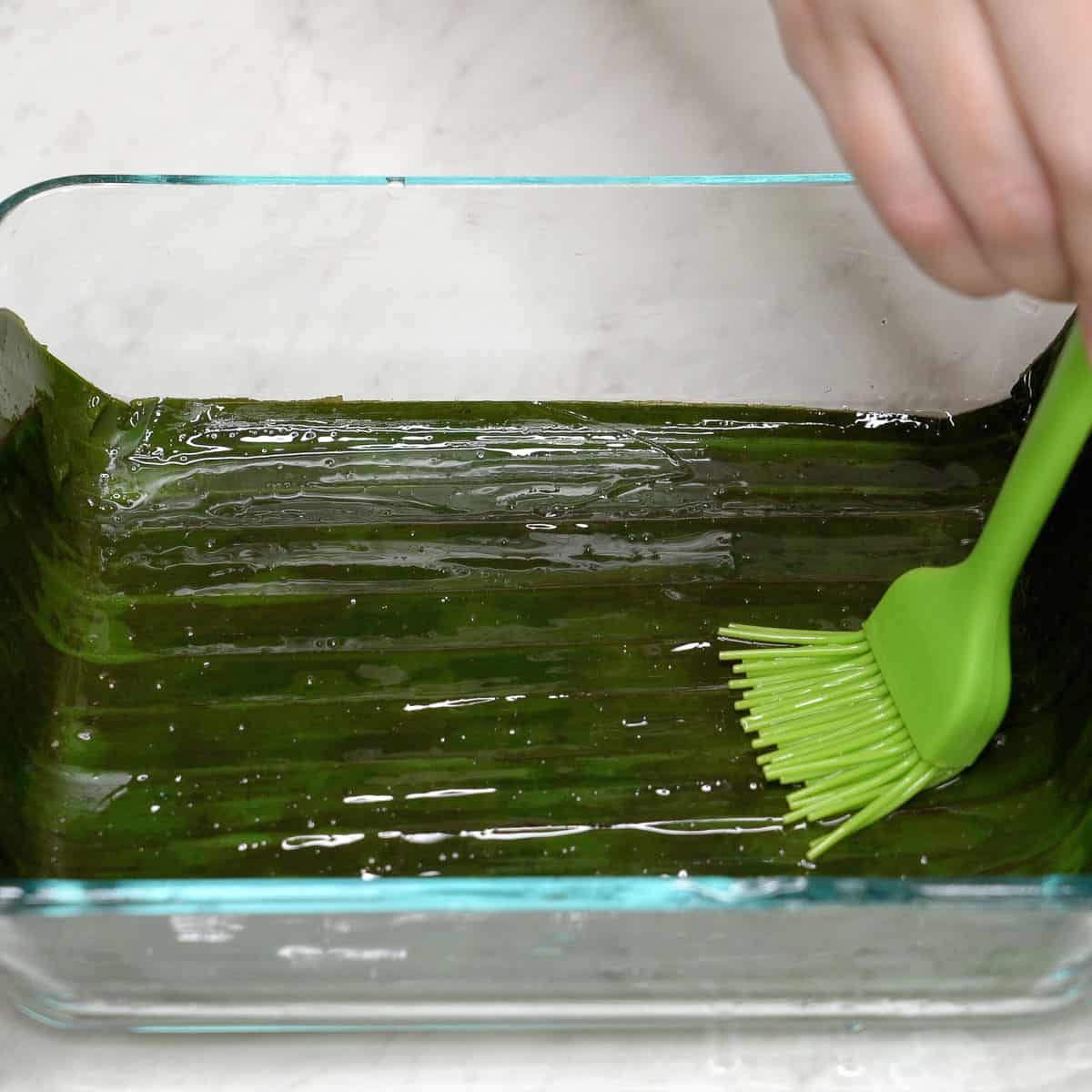 Greasing the pan for inutak.