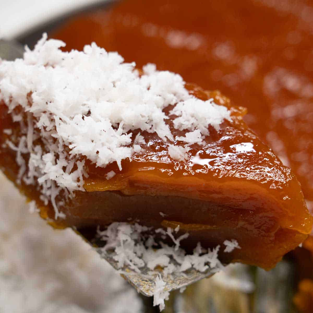 Kutsinta with coconut on a spatula.