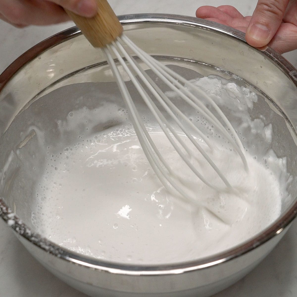 Mixing the batter for sweet potato fritters.