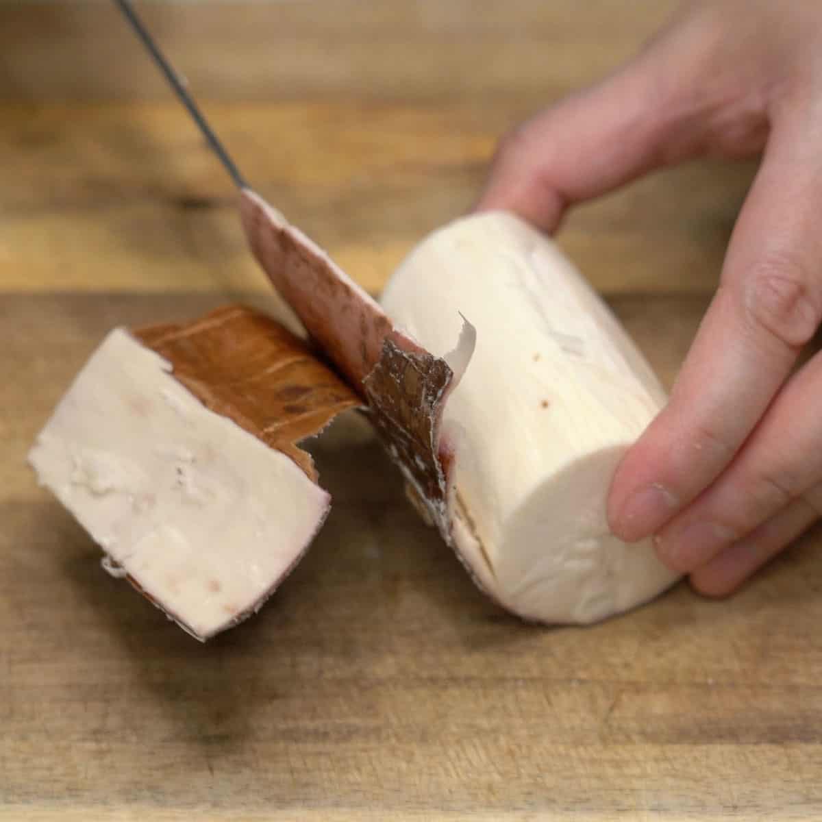 Peeling cassava root.