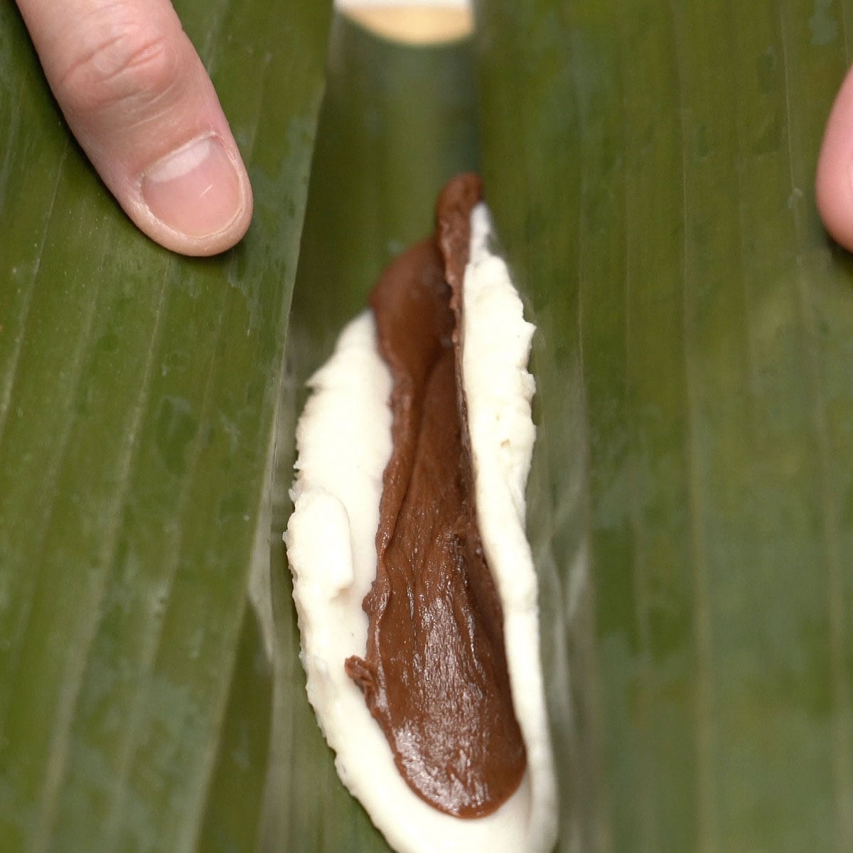 Rolling suman moron in banana leaves.