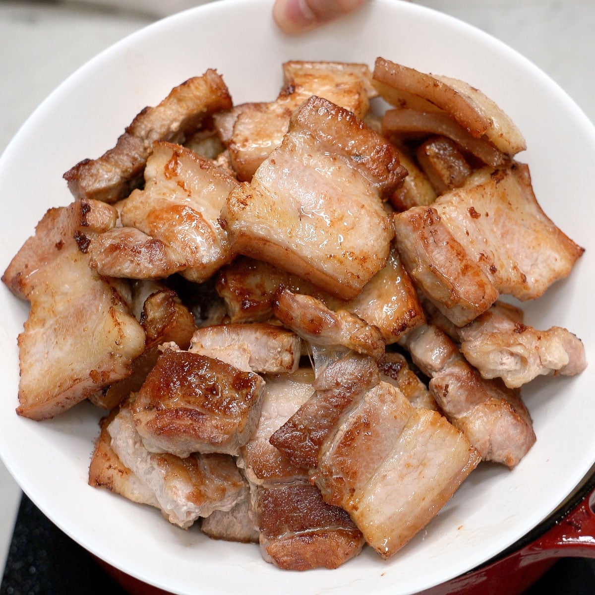 Seared pork in a bowl.