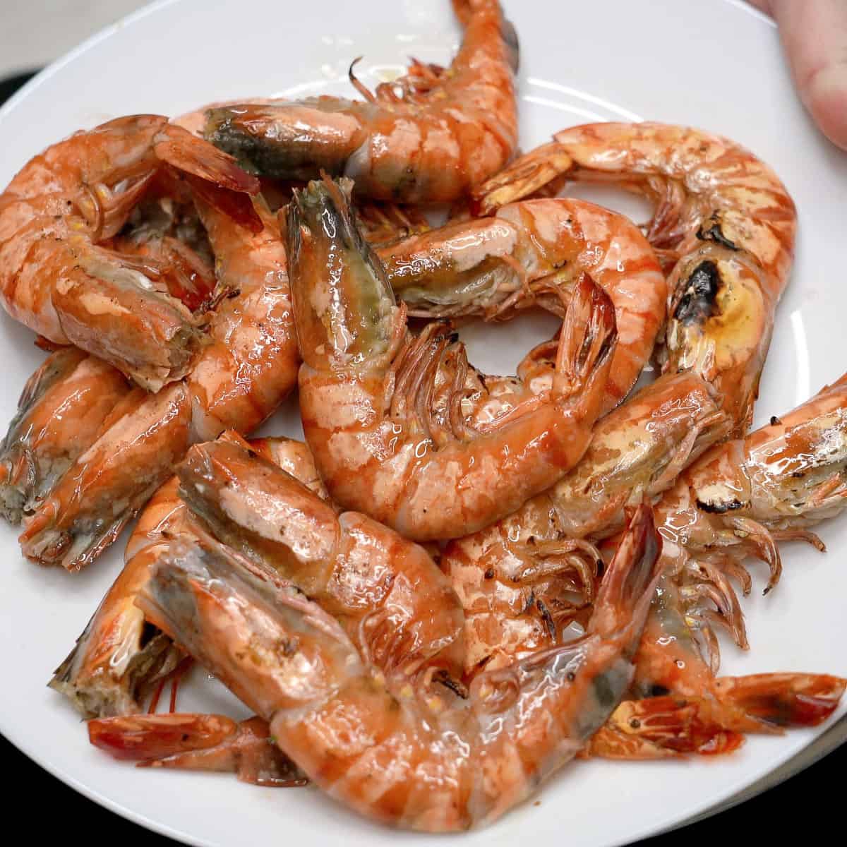 Seared shrimp on a plate.