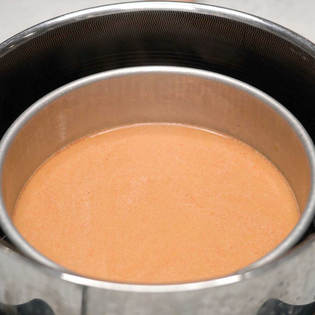 Steaming kutsinta bottom layer in a steamer.