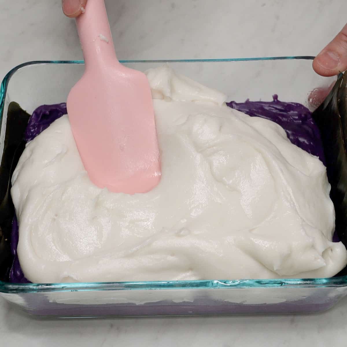 Spreading the white layer in the dish.