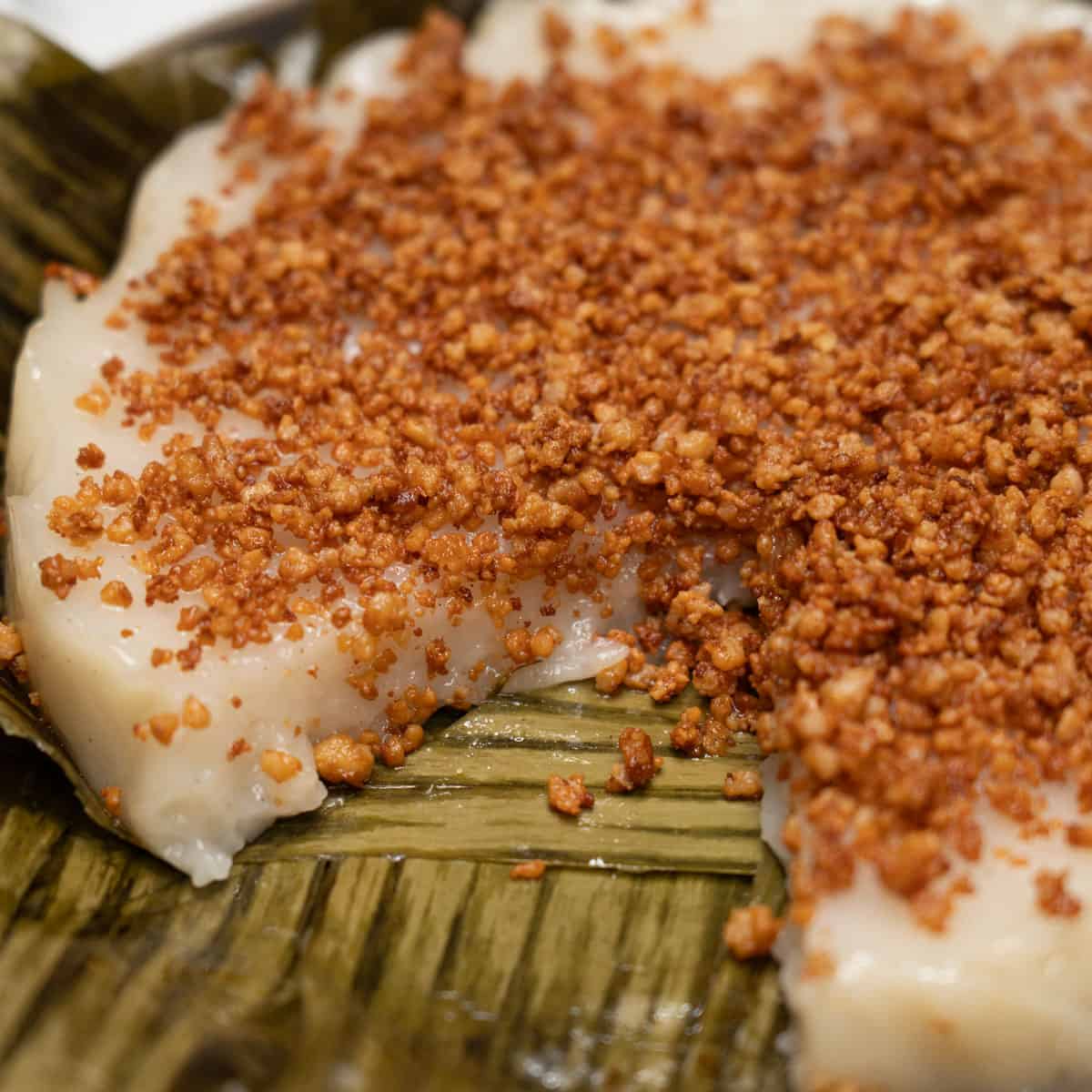 Sliced kalamay lansong generously topped with latik.