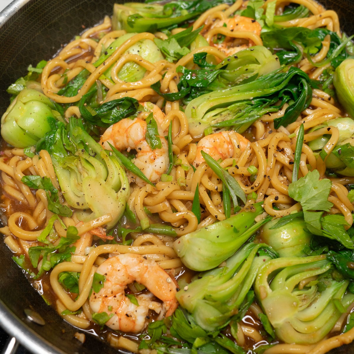 Pancit chami with shrimp in the wok.