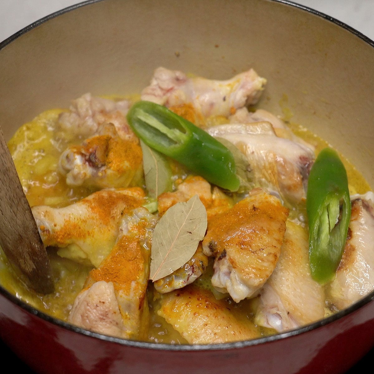 Adobong dilaw simmering in a bowl.