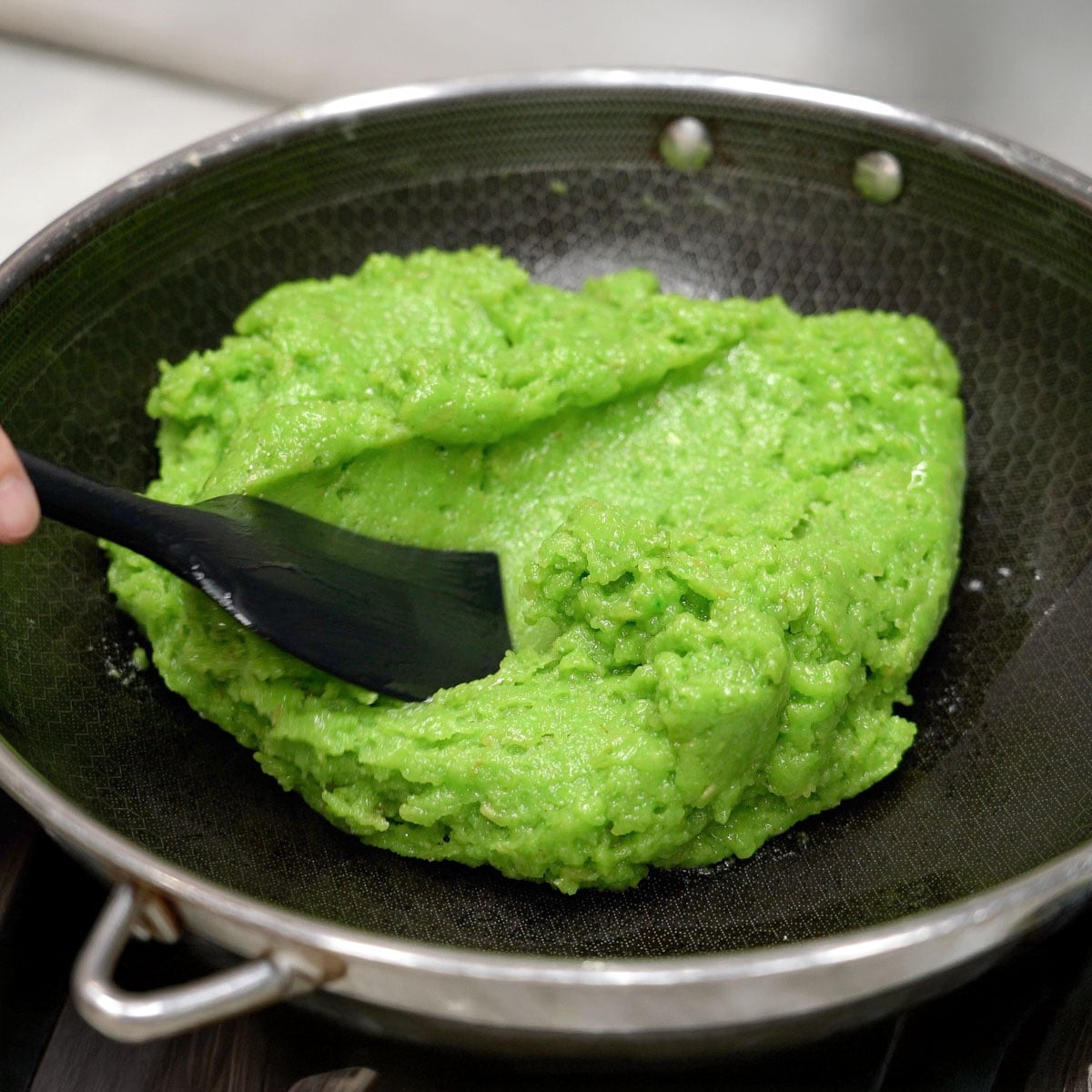 Cooked suman pinipig in a wok.